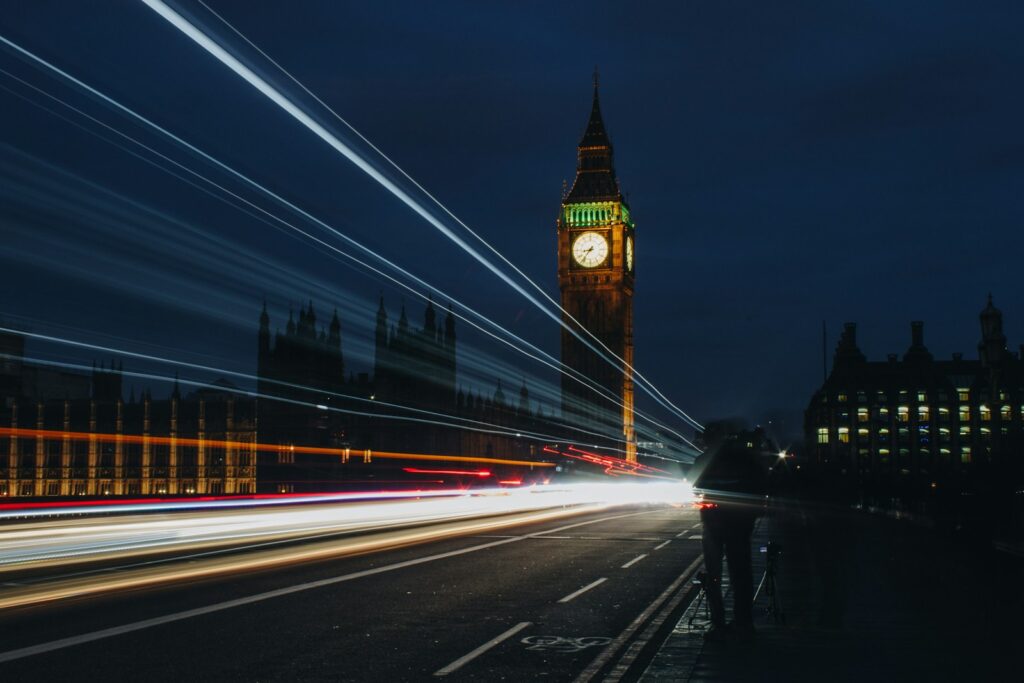 Photo by Louis. K time lapse photography of road near Elizabeth's tower